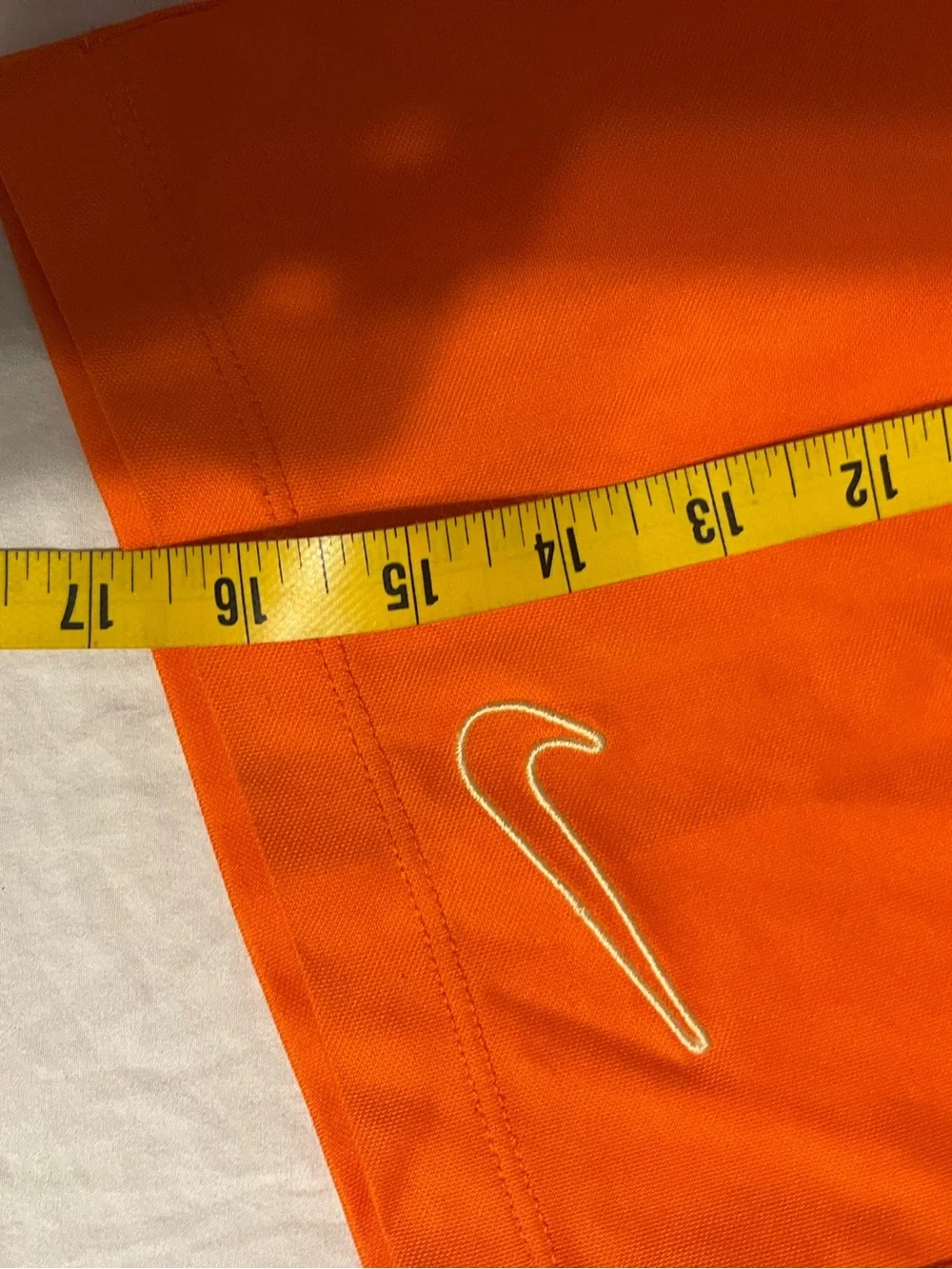 Nike Girl's Bright Orange Athletic Shorts with White Swoosh